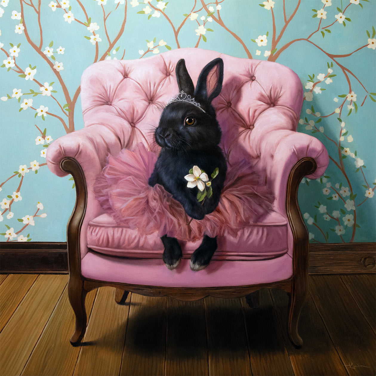 Black rabbit in a tutu sitting on a pink chair in front of floral wallpaper, holding an apple blossom.